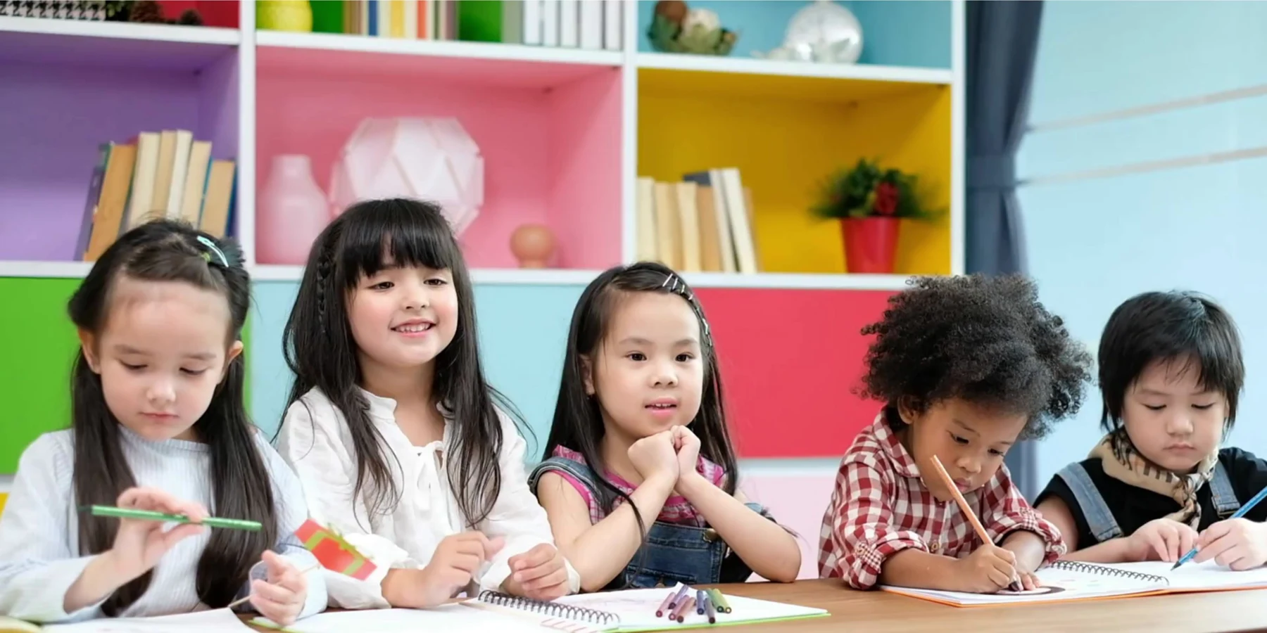 Children learning and working together in a classroom